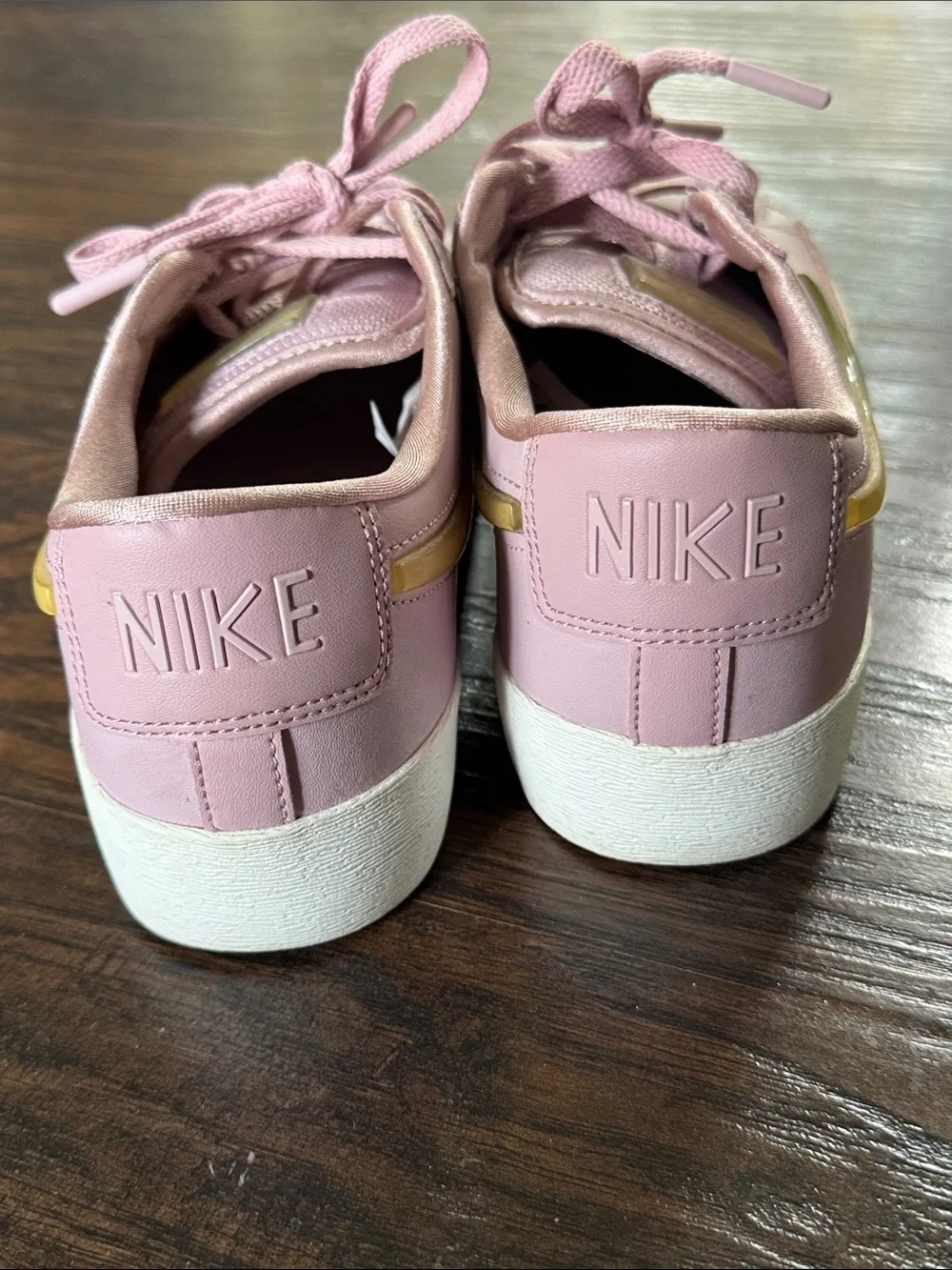 Nike Women's Blush Pink Low-Top Leather Sneakers with Metallic Gold Swoosh